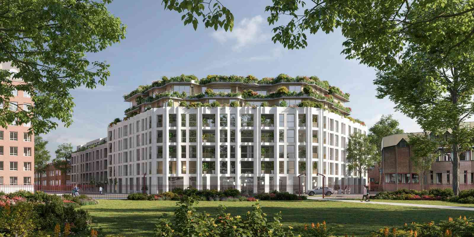 Impressie van woongebouw Central Park 076 in Breda met witte gevel en groene daktuinen